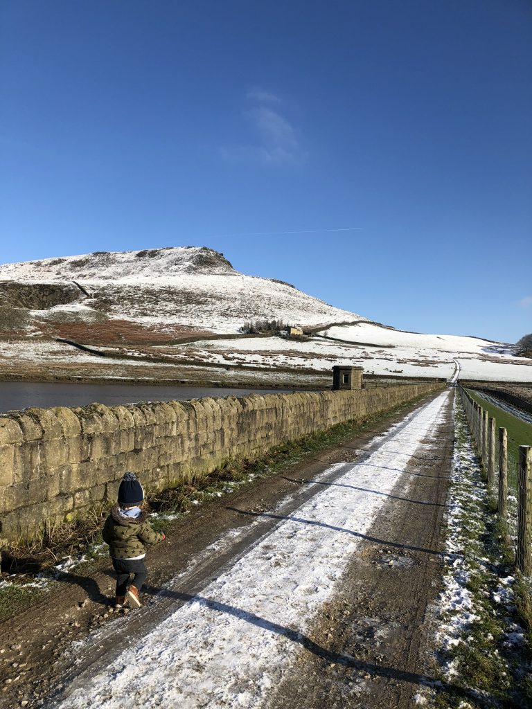 Reservoir crest road with views of the crag