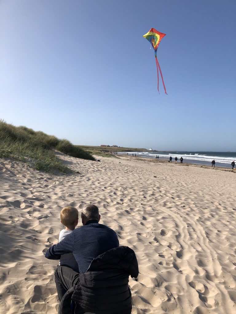 flying kites on bamburgh beach